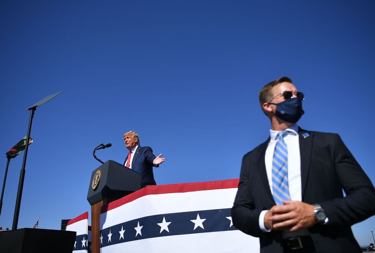 A US secret service agent stands guard as US President Donald Trump speaks during a rally at Prescott Regional Airport in Prescott, Arizona on October 19, 2020. (MANDEL NGAN/AFP via Getty Images)