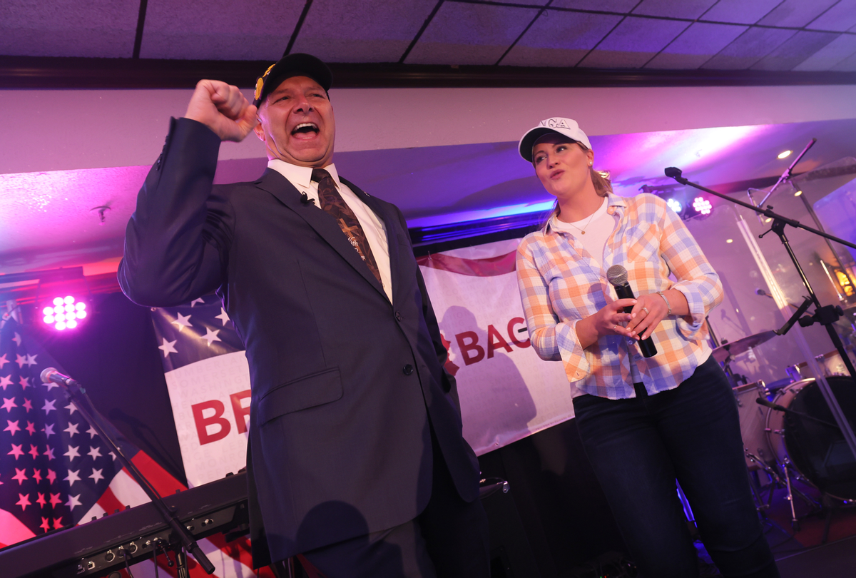 Pennsylvania Republican gubernatorial candidate Doug Mastriano greets supporters as Jenna Ellis, former Legal Advisor and Counsel to former President Donald Trump, stands on stage during his election night party at The Orchards on May 17, 2022. (Michael M. Santiago/Getty Images)