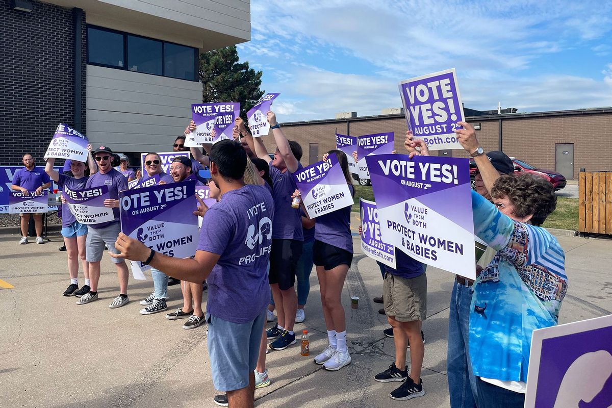 Supporters of Value Them Both, a constitutional amendment that would remove language guaranteeing the right to an abortion from the Kansas state constitution, rally before campaigning in Shawnee, Kansas, on July 30, 2022. (CAITLIN WILSON/AFP via Getty Images)