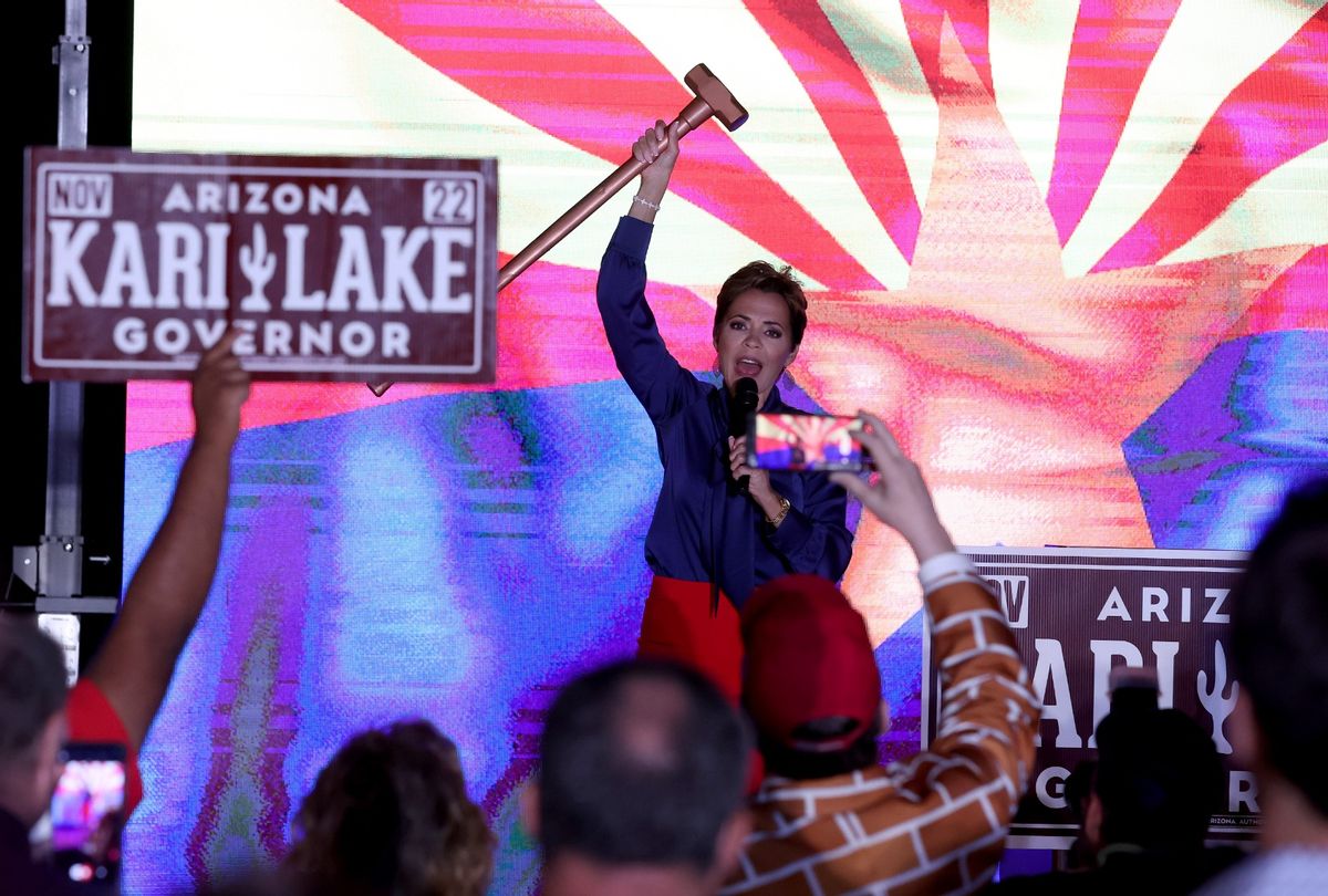 Republican candidate for Arizona Governor Kari Lake holds up a sledgehammer as she speaks to supporters during her primary election night gathering on August 03, 2022 in Scottsdale, Arizona. (Justin Sullivan/Getty Images)