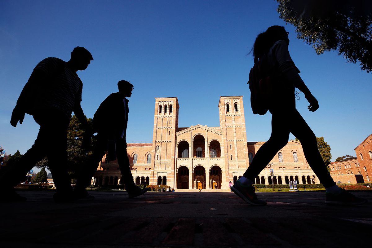 Royce Hall on the campus of the University of California, Los Angeles (UCLA) as UCLA lecturers and students walk by (Al Seib / Los Angeles Times via Getty Images)