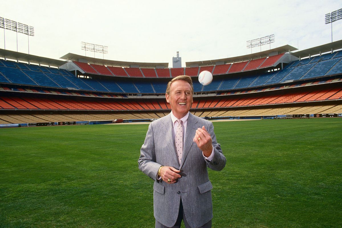 Voice of the Los Angeles Dodgers radio broadcasts, Vin Scully, poses in the outfield of Dodger Stadium, Los Angeles, California. (George Rose/Getty Images)