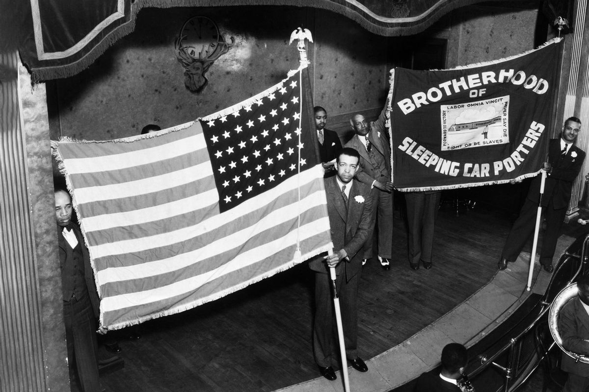Members of the Brotherhood of Sleeping Car Porters, the first successful African-American Labor Union, proudly display their banner at a 1955 ceremony celebrating the organization's 30th anniversary. (Getty Images / Bettmann / Contributor)