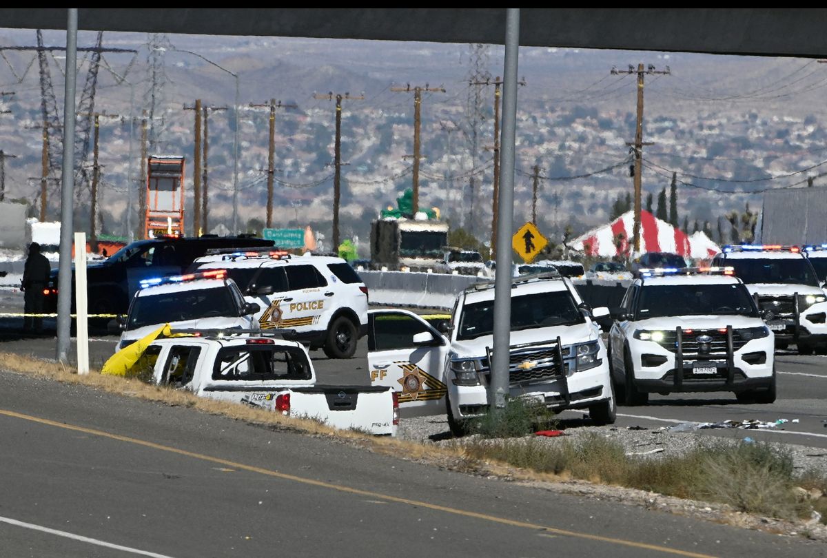 Law enforcement vehicles surrounded the vehicle driven by Anthony John Graziano, 45, following a gun battle with the man on the 15 freeway in Victorville Tuesday, Sept. 27, 2022. (Will Lester/MediaNews Group/Inland Valley Daily Bulletin via Getty Images)
