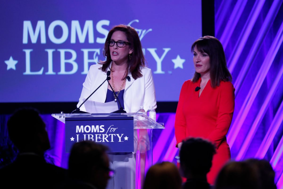 Moms for Liberty founders Tiffany Justice (left) and Tina Descovich give the opening remarks during the inaugural Moms For Liberty Summit on July 15, 2022, in Tampa, Florida. (Octavio Jones/Getty Images)