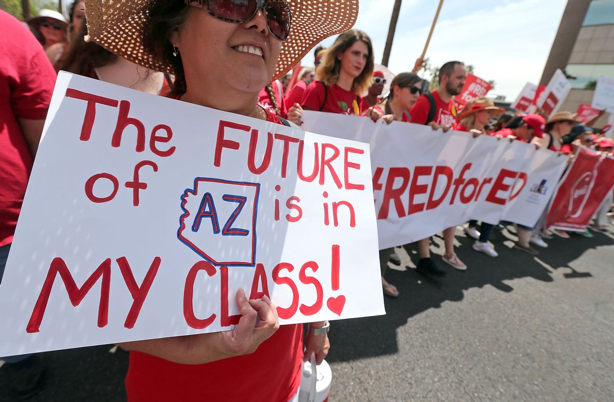 Arizona teachers march toward the State Capitol as part of a rally for higher wages and better funding on April 26, 2018, in Phoenix. (Ralph Freso/Getty Images)