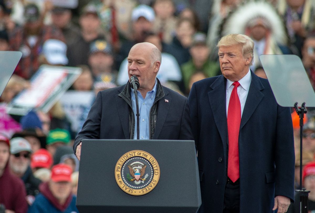 Greg Gianforte (R-MT) joins Donald Trump at a "Make America Great Again" rally at the Bozeman Yellowstone International Airport on November 3, 2018 in Belgrade, Montana.  (William Campbell/Corbis via Getty Images)