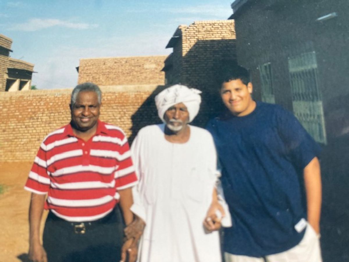 The author (left) with his father and son, on a visit to his native village in Sudan, circa 2000. (Courtesy of Mohammad Ali Salih)