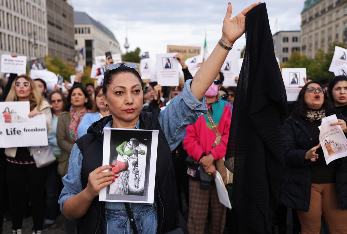 Protesters, including one woman holding up a headscarf, gather to demonstrate against the death of Mahsa Amini in Iran on September 23, 2022 in Berlin, Germany.
 (Sean Gallup/Getty Images)