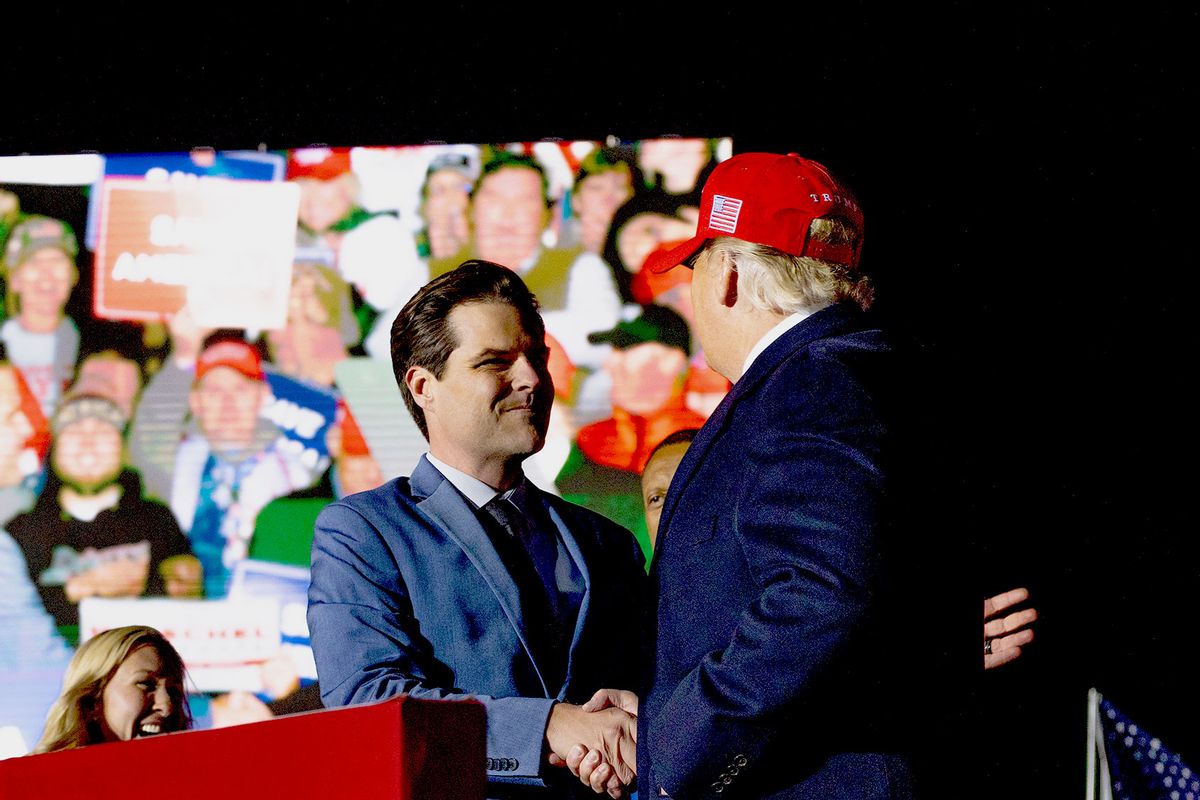 Rep. Matt Gaetz (R-FL) (L) shakes hands with former U.S. President Donald Trump (R) during a rally at the Banks County Dragway on March 26, 2022 in Commerce, Georgia. (Megan Varner/Getty Images)