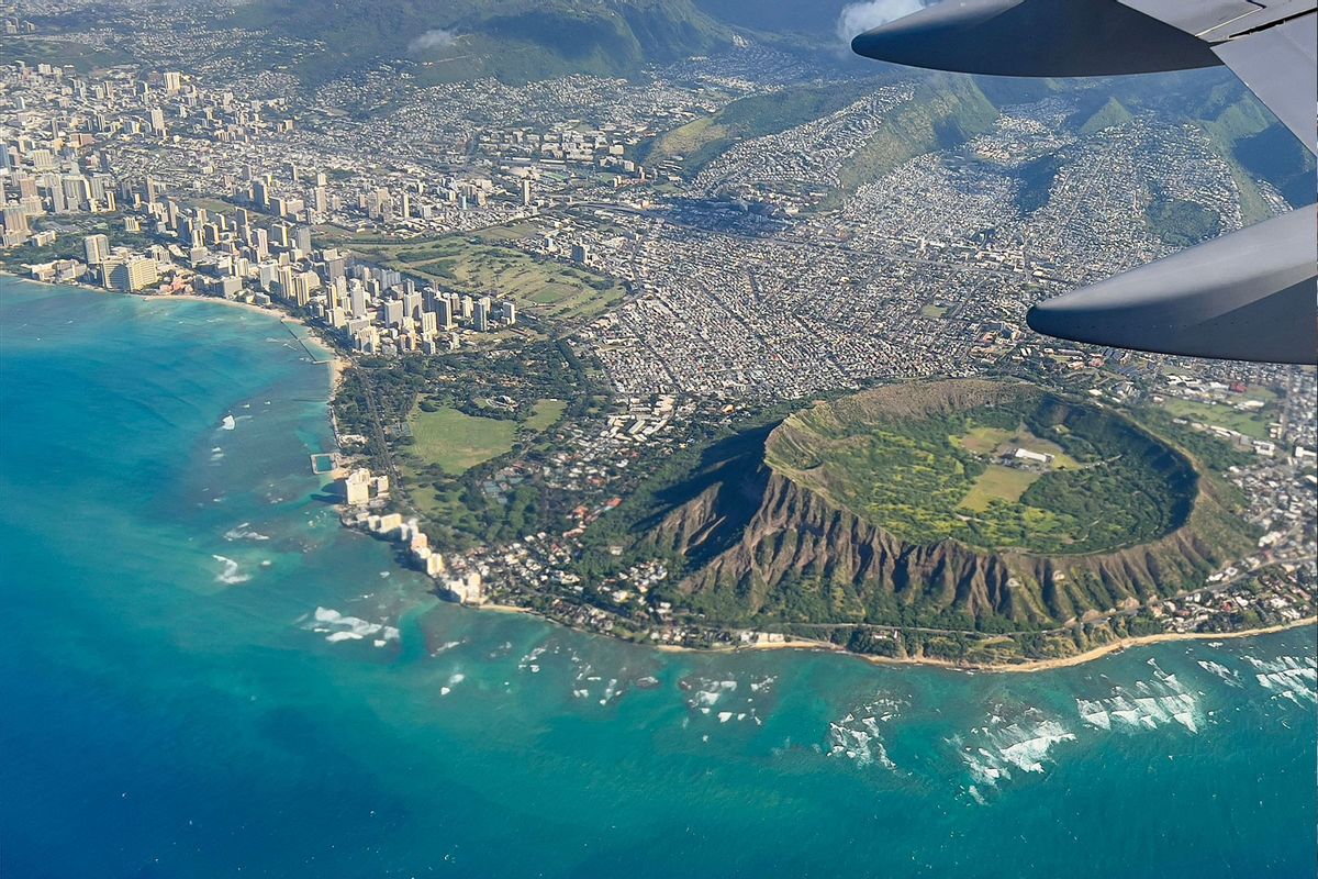 An aerial view from the window of a plane shows Diamond Head crater in Oahu, Hawaii on February 23, 2022. (DANIEL SLIM/AFP via Getty Images)