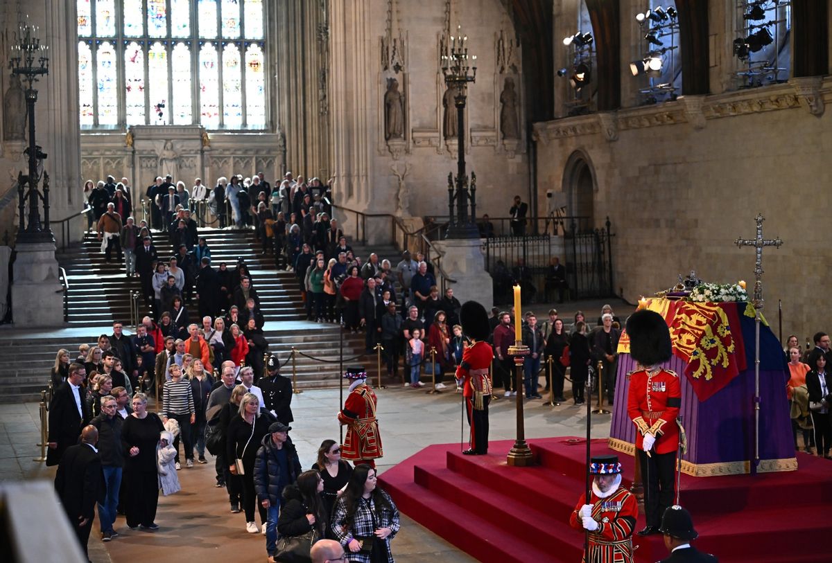 Members of the public pay their respects as they pass the coffin of Queen Elizabeth II as it Lies in State inside Westminster Hall, at the Palace of Westminster. (Marco Bertorello - WPA Pool/Getty Images)