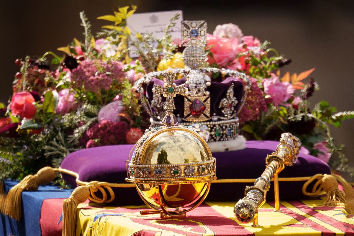 The coffin of Queen Elizabeth II with the Imperial State Crown resting on top is carried by the Bearer Party as it departs Westminster Abbey during the State Funeral of Queen Elizabeth II on September 19, 2022 in London, England.  (Christopher Furlong/Getty Images)