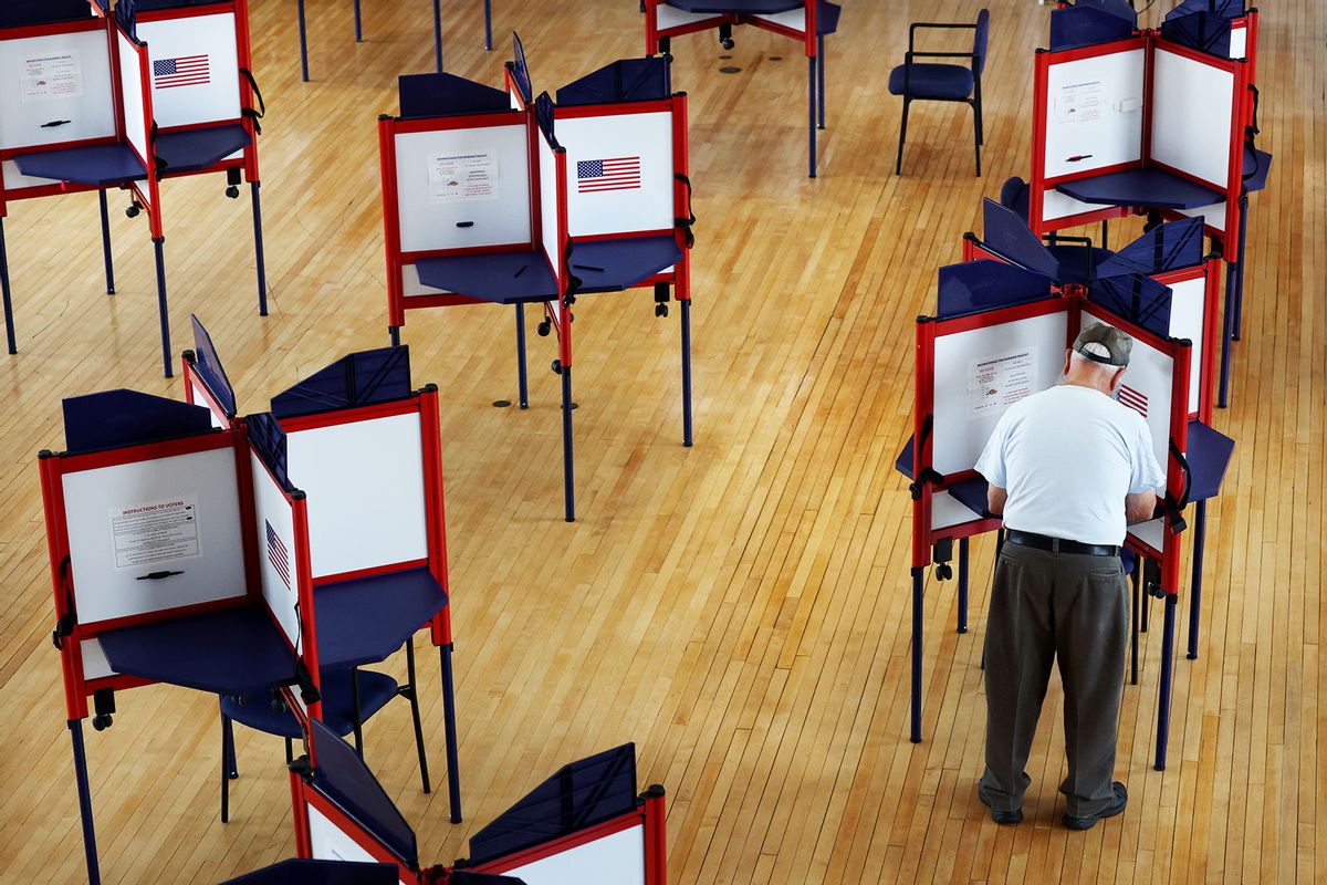 A voter fills out his ballot at the early voting location at the town hall in Quincy, MA on August 27, 2022. (Craig F. Walker/The Boston Globe via Getty Images)