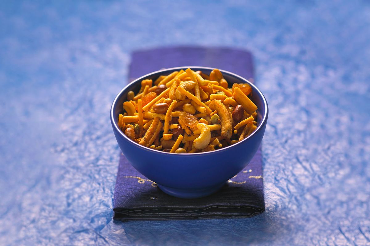 Indian Bombay mix or Chevdo served in a blue bowl (Getty Images/Andrew Bret Wallis)