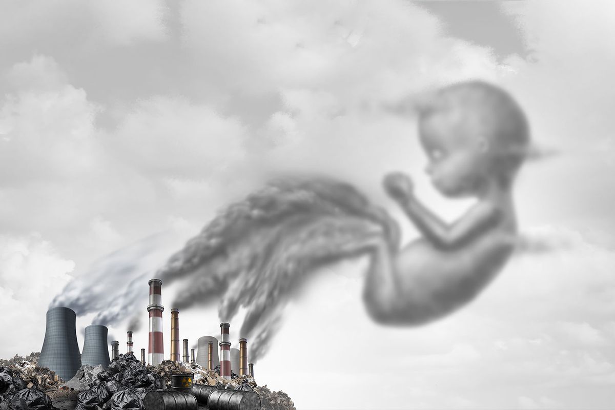 Pollution and pregnancy risk to the unborn fetus as polluted smoke stacks and toxic waste as an environmental danger to a mother and baby (Getty Images/wildpixel)