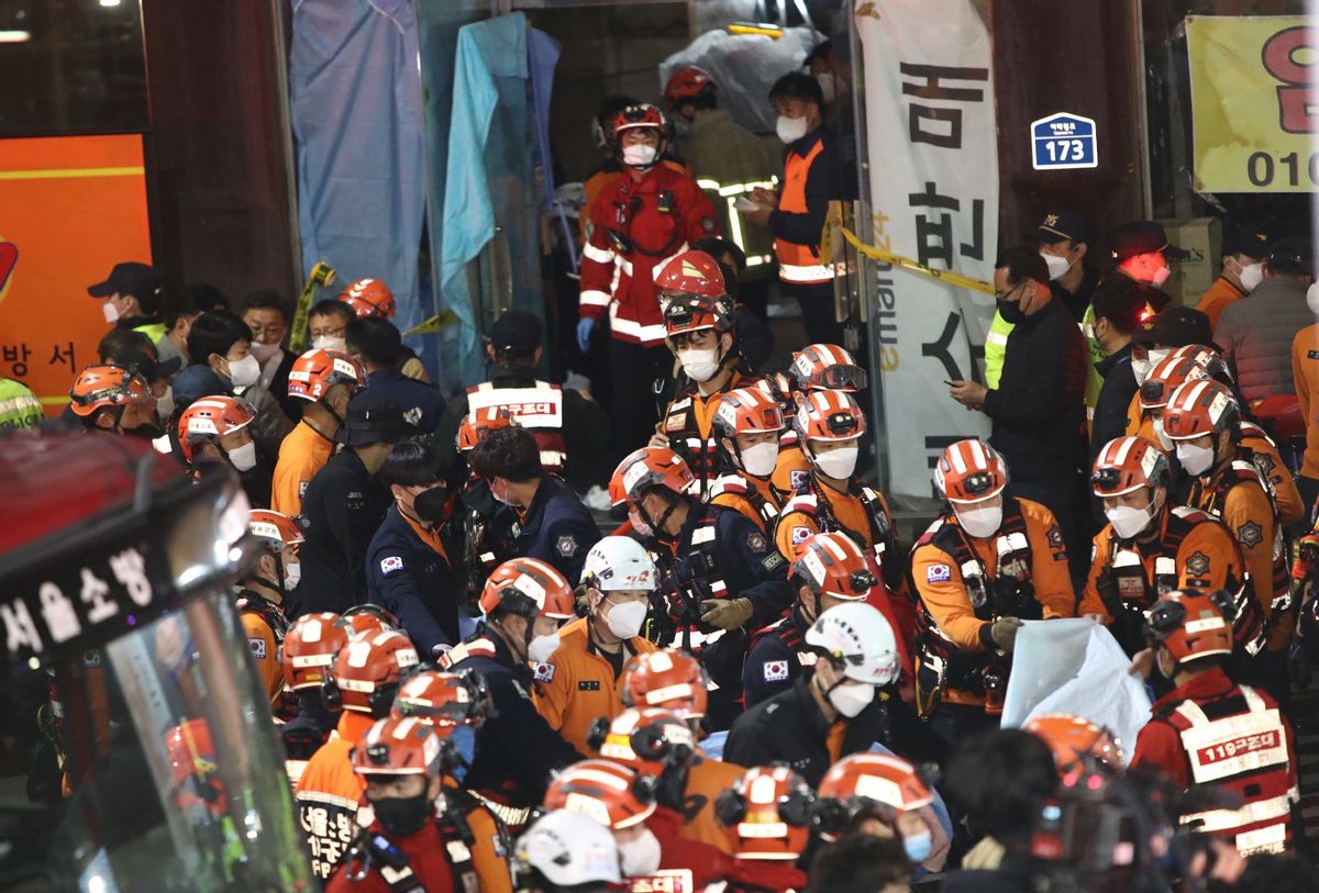 Emergency services treat injured people after a stampede on October 30, 2022 in Seoul, South Korea.  (Chung Sung-Jun/Getty Images)