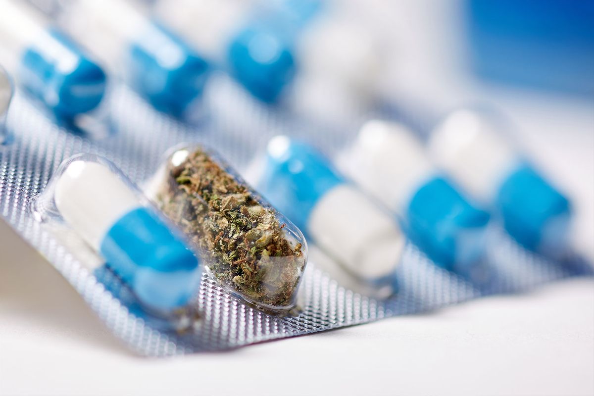 Capsule pills and marijuana in a blister-pack (Getty Images / Ilya Sereda / EyeEm)