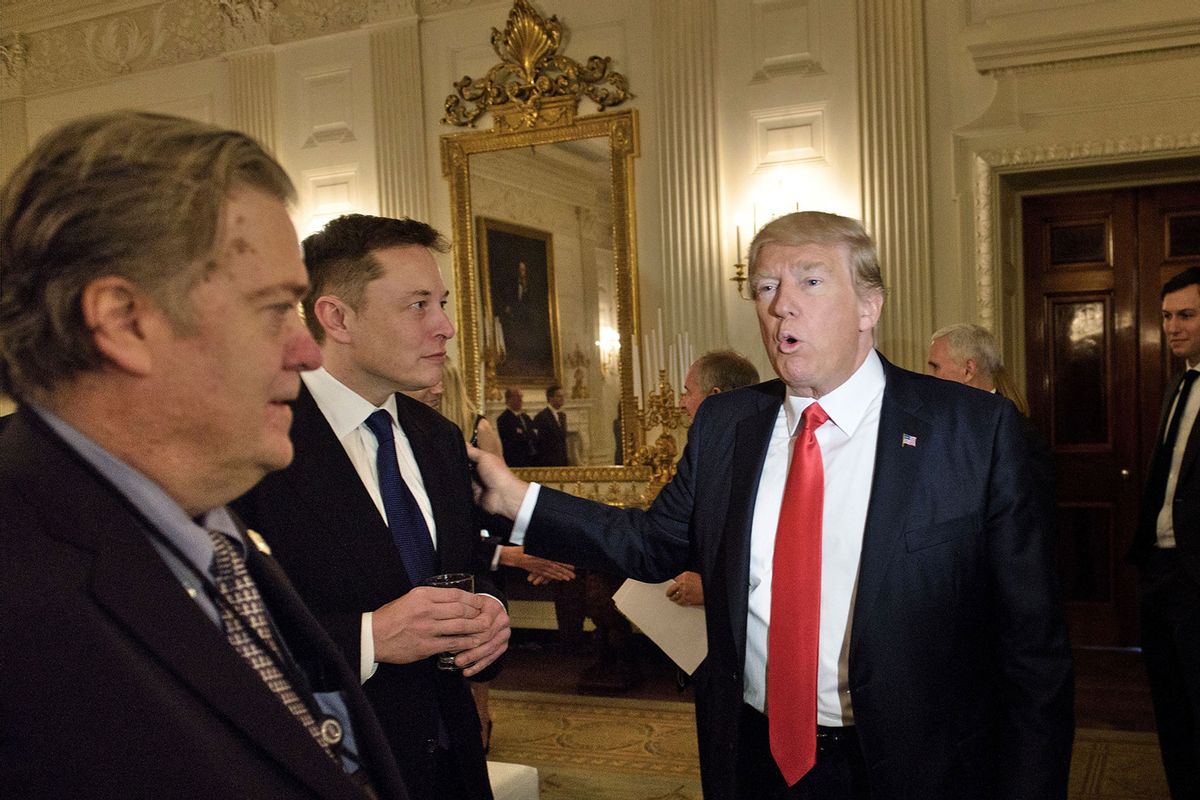 Trump advisor Steve Bannon (L) watches as US President Donald Trump greets Elon Musk, SpaceX and Tesla CEO, before a policy and strategy forum with executives in the State Dining Room of the White House February 3, 2017 in Washington, DC. (BRENDAN SMIALOWSKI/AFP via Getty Images)
