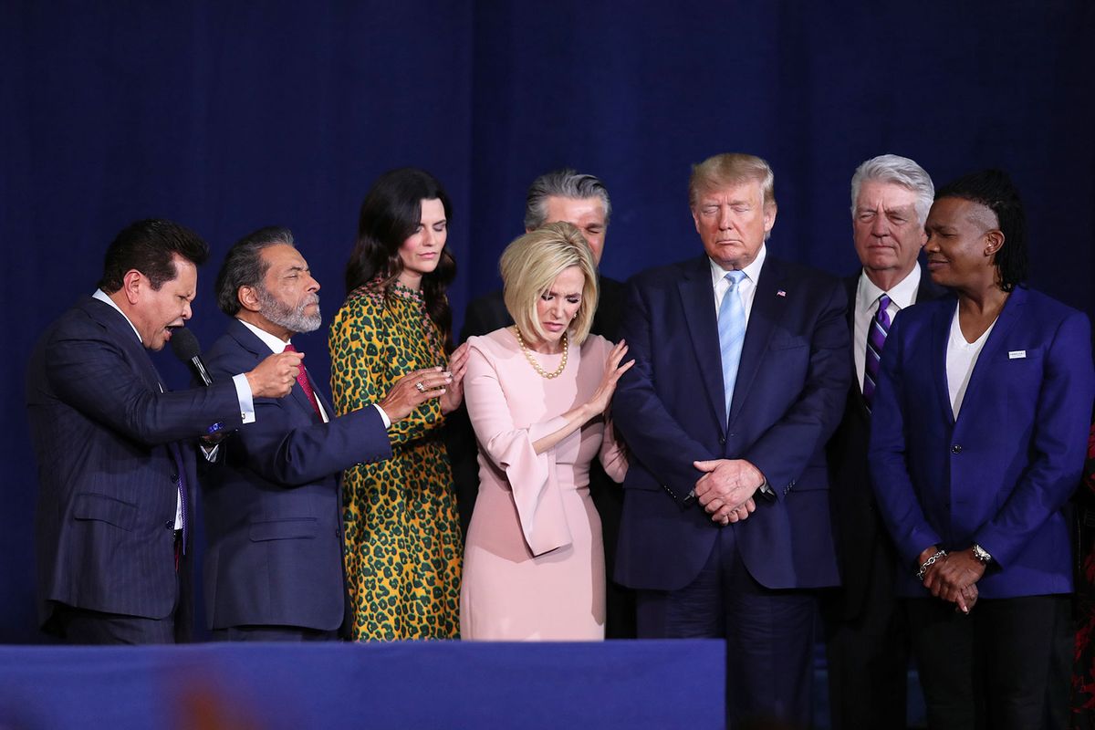 Faith leaders pray over President Donald Trump during a 'Evangelicals for Trump' campaign event held at the King Jesus International Ministry on January 03, 2020 in Miami, Florida. (Joe Raedle/Getty Images)