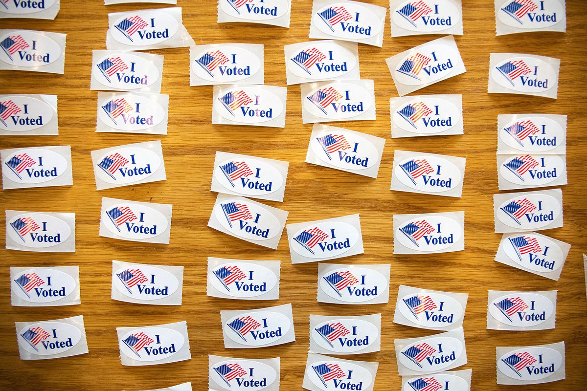 "I Voted" stickers cover a table at a polling station (LOGAN CYRUS/AFP via Getty Images)