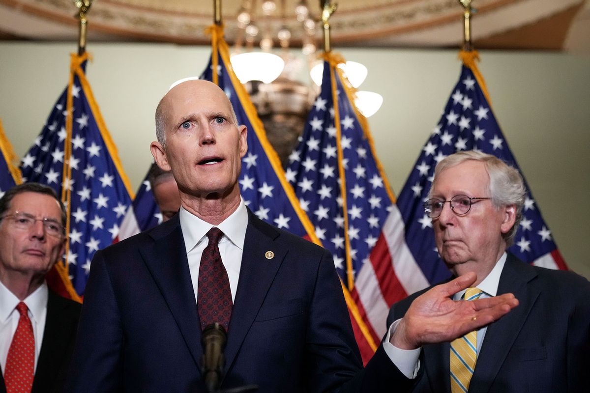 Flanked by Sen. John Barrasso (R-WY) and Senate Minority Leader Mitch McConnell (R-KY), Sen. Rick Scott (R-FL) speaks during a news conference after a closed-door lunch with Senate Republicans at the U.S. Capitol on May 17, 2022 in Washington, DC. (Drew Angerer/Getty Images)