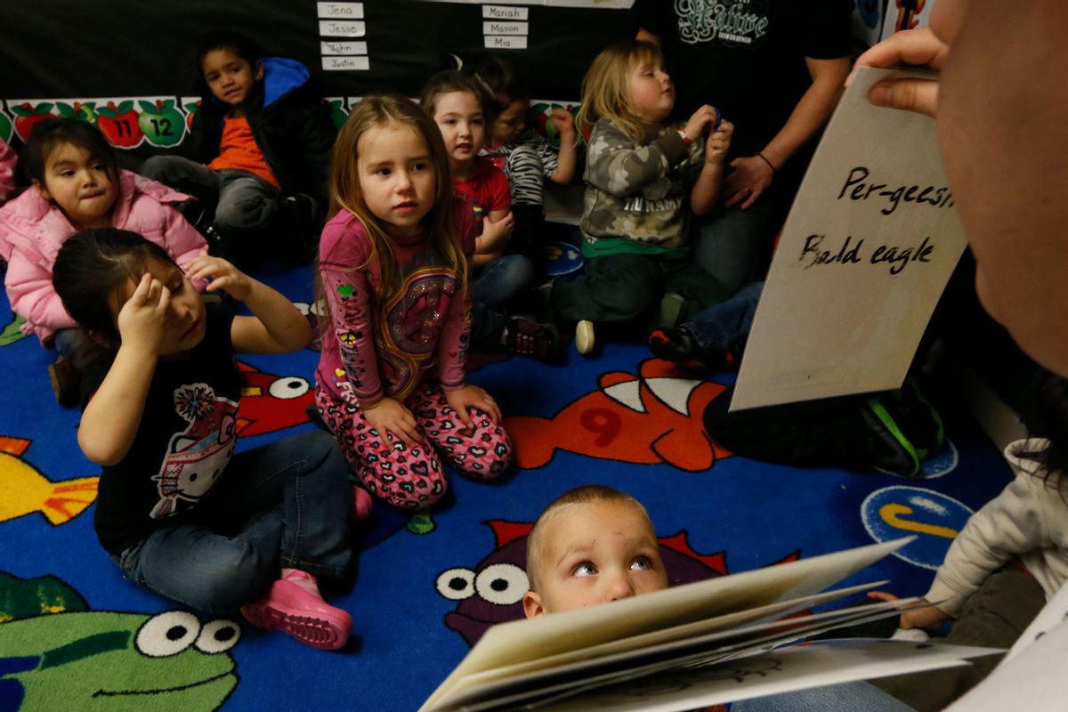 Mike Carlson, 19, teaches pre-school age children Yurok words at the Klamath Family Head Start program. The Yurok tribal language revitalization program has developed curricula for all ages. (Robert Gauthier/Los Angeles Times via Getty Images)