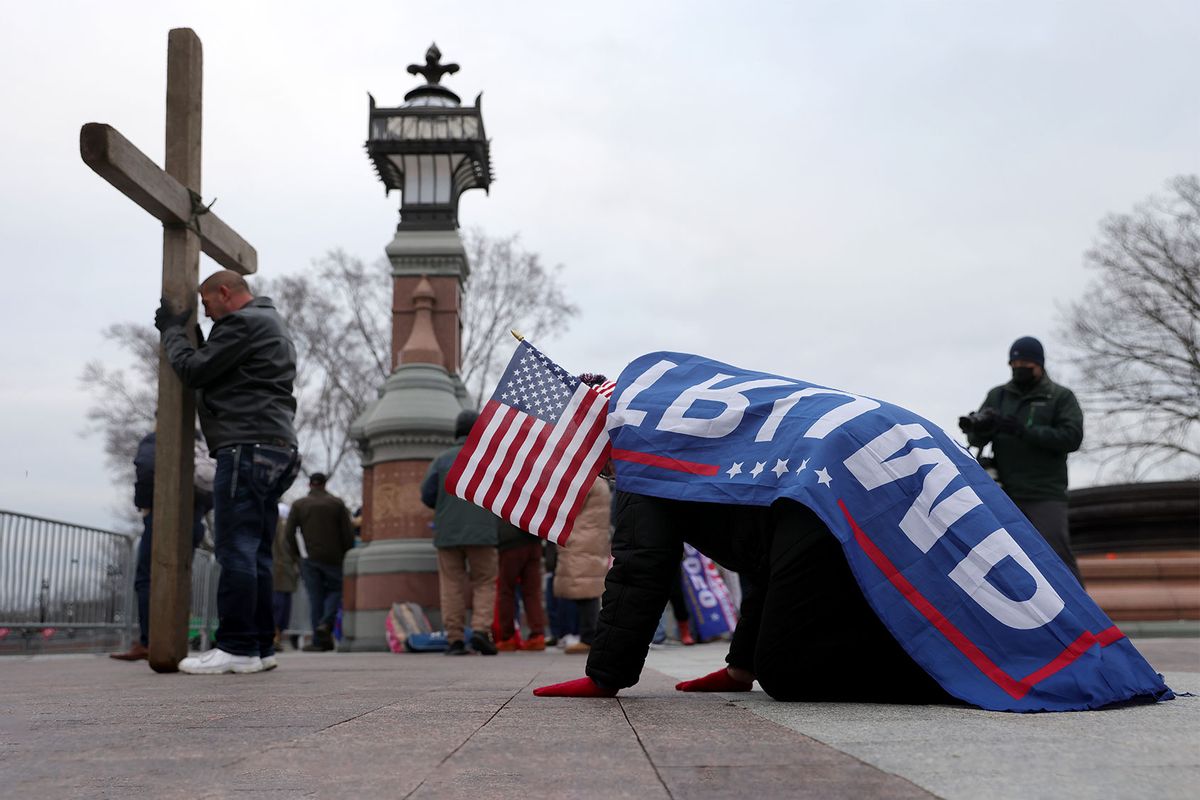 Supporters of U.S. President Donald Trump pray outside the U.S. Capitol January 06, 2021 in Washington, DC. (Win McNamee/Getty Images)