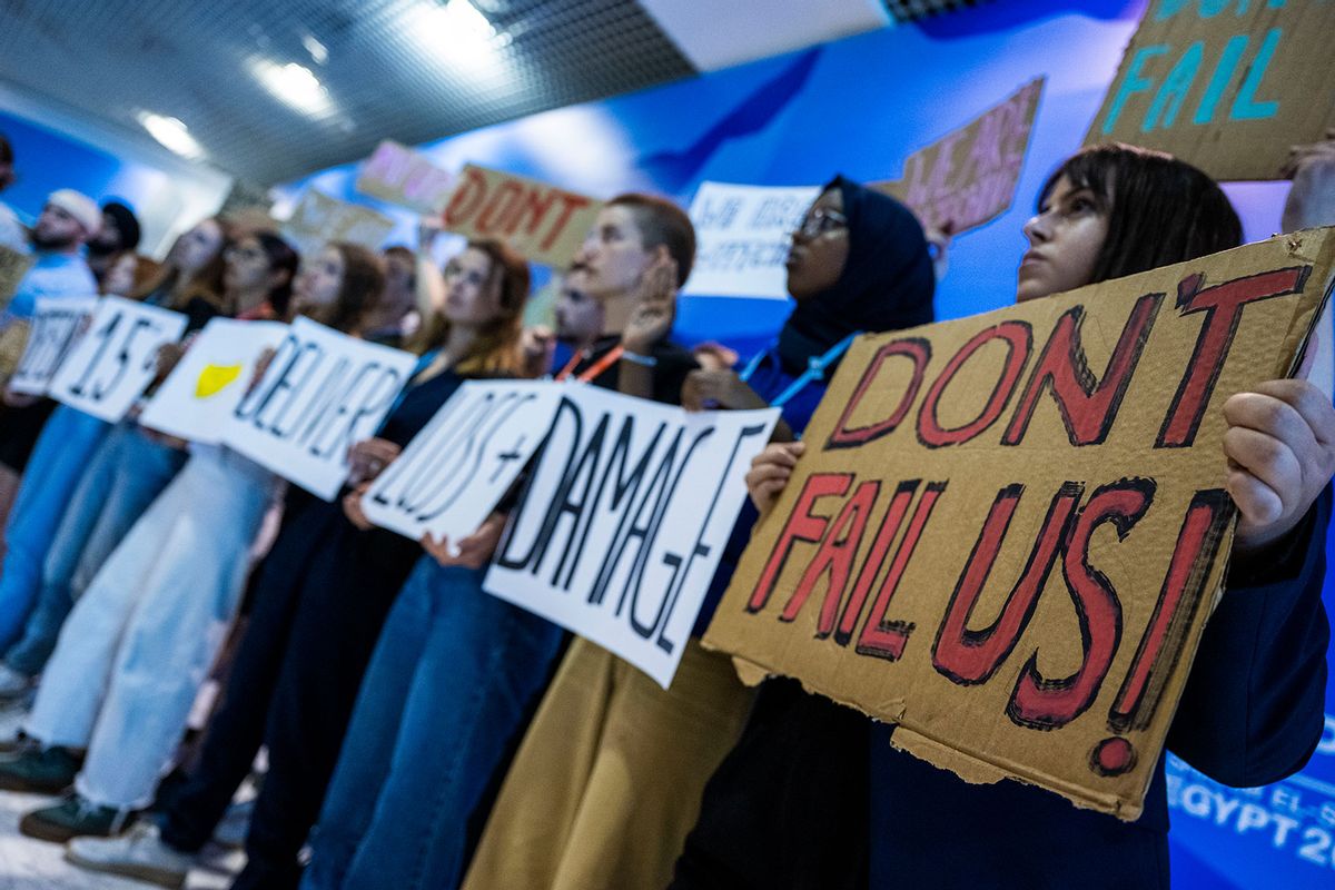 Participants in a demonstration at the UN Climate Summit COP27, including Luisa Neubauer (3rd from right), climate activist with the Fridays for Future movement, hold placards and advocate for the 1.5 degree Celsius global temperature rise target. (Christophe Gateau/picture alliance via Getty Images)