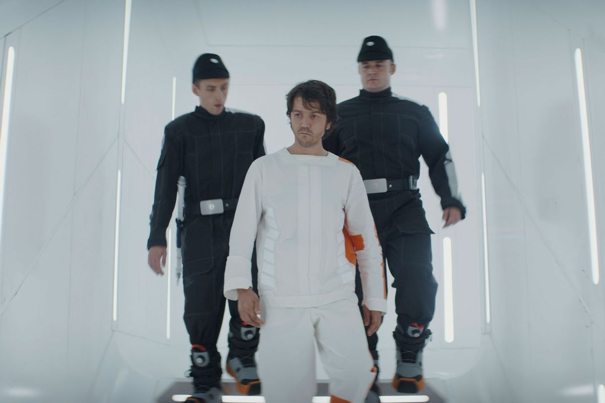 Cassian Andor (Diego Luna) with delivery guards (Kenny Fullwood and Josh Herdman) in "Andor." (Lucasfilm/Disney)