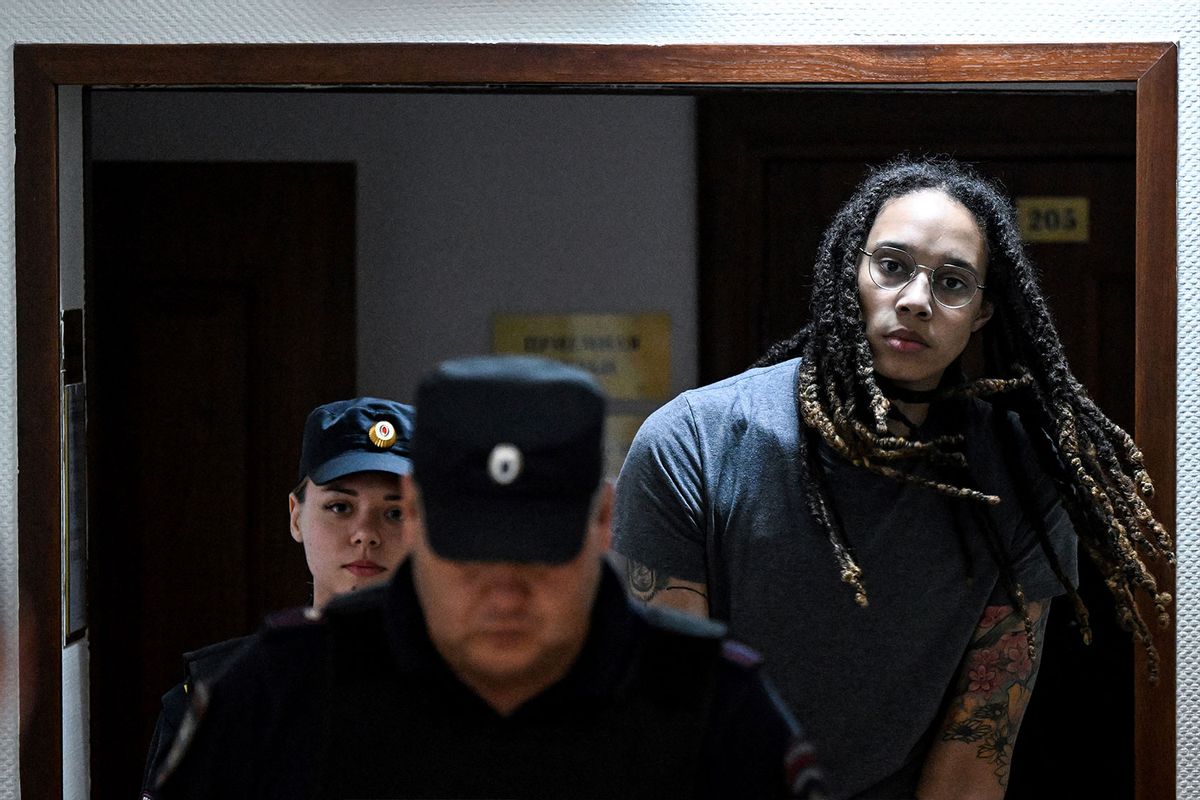 US Women National Basketball Association's (WNBA) basketball player Brittney Griner, who was detained at Moscow's Sheremetyevo airport and later charged with illegal possession of cannabis, is escorted to the courtroom to hear the court's final decision in Khimki outside Moscow, on August 4, 2022. (KIRILL KUDRYAVTSEV/AFP via Getty Images)