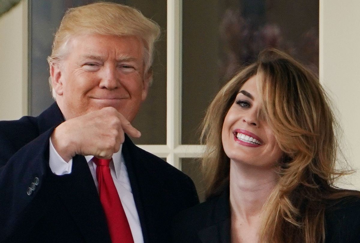 Former President Donald Trump points to former communications director Hope Hicks at the White House on March 29, 2018. (MANDEL NGAN/AFP via Getty Images)