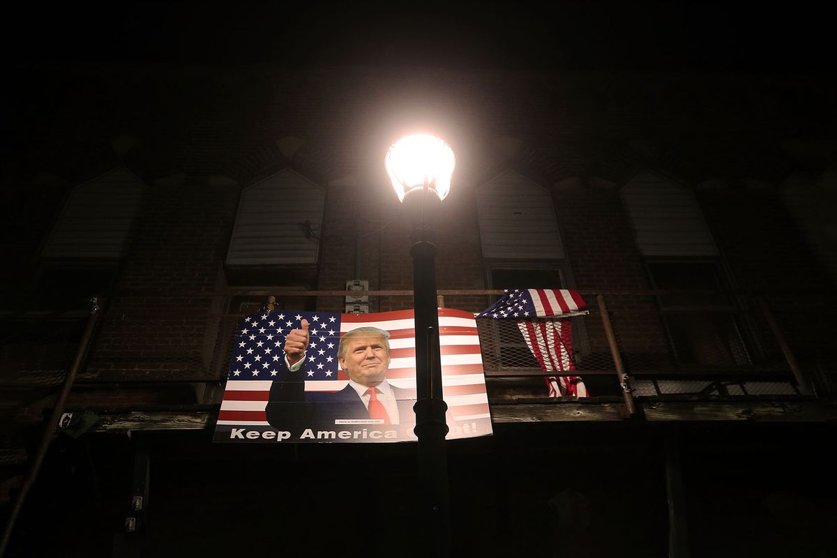 A poster of President Donald Trump is displayed along a street on October 29, 2020 in Winterset, Iowa. (Mario Tama/Getty Images)