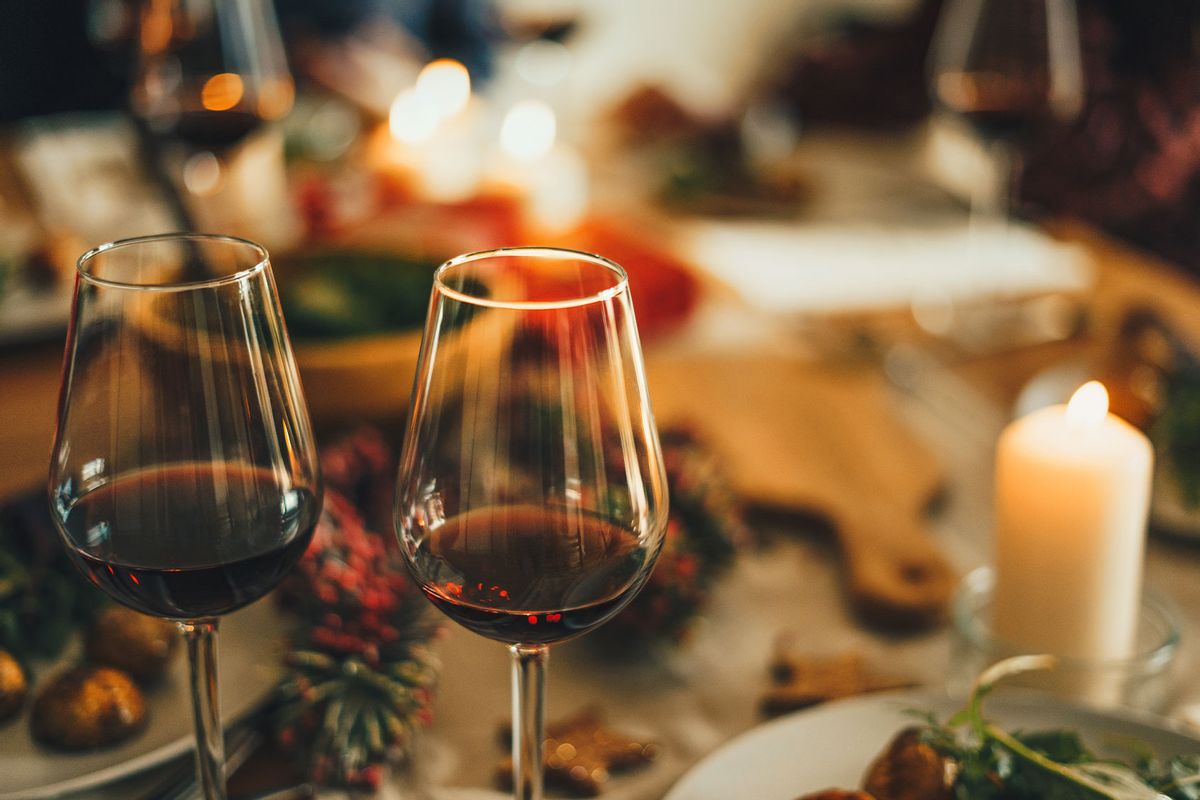 Red wine at the Christmas dinner table (Getty Images/Xsandra)