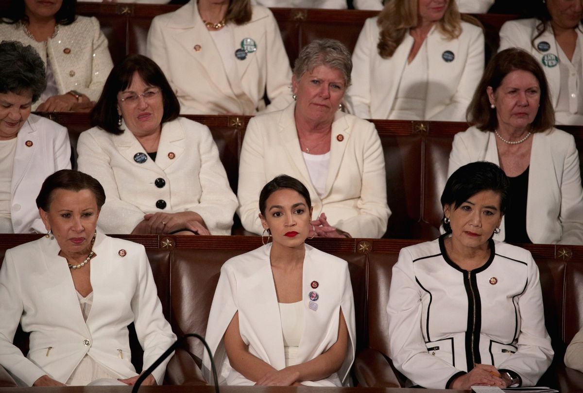 Rep. Alexandria Ocasio-Cortez (D-NY) watches former President Donald Trump's State of the Union address in the chamber of the U.S. House of Representatives at the U.S. Capitol Building on February 5, 2019 in Washington, DC. A group of female Democratic lawmakers chose to wear white to the speech in solidarity with women and a nod to the suffragette movement. (Alex Wong/Getty Images)