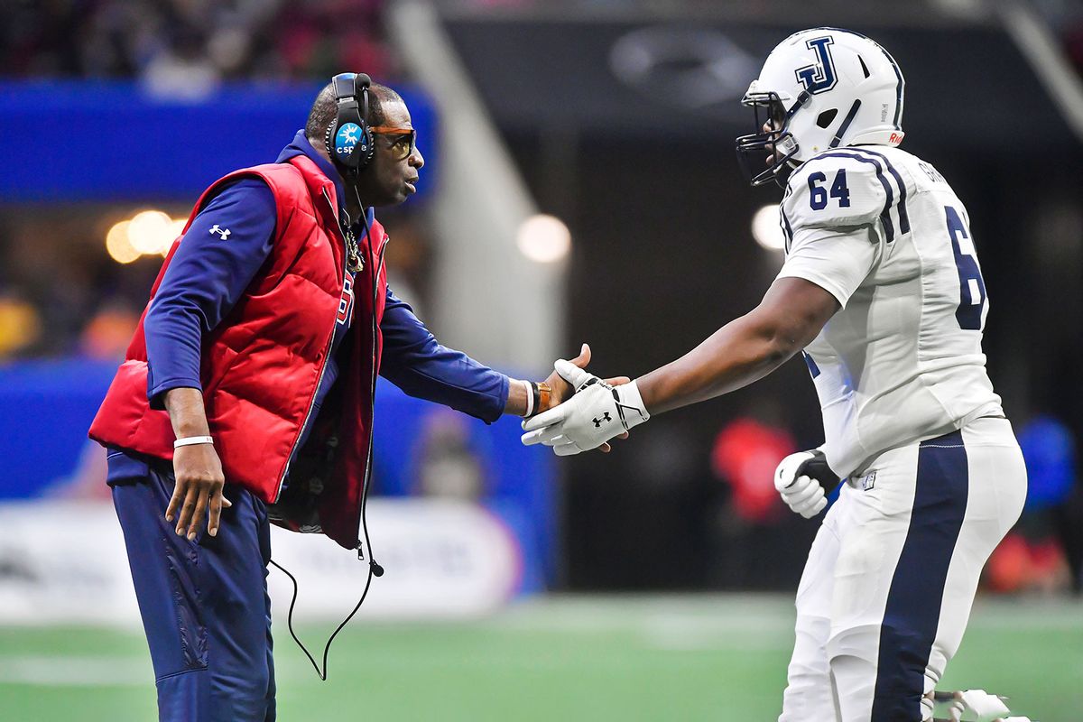Jackson State Tigers coach Deion Sanders greets right tackle Deiontae Graham (64) during the college football Cricket Celebration Bowl between the North Carolina Central Eagles and Jackson State Tigers on Saturday, December 17, 2022 at Mercedes-Benz Stadium in Atlanta, GA. (Austin McAfee/Icon Sportswire via Getty Images)
