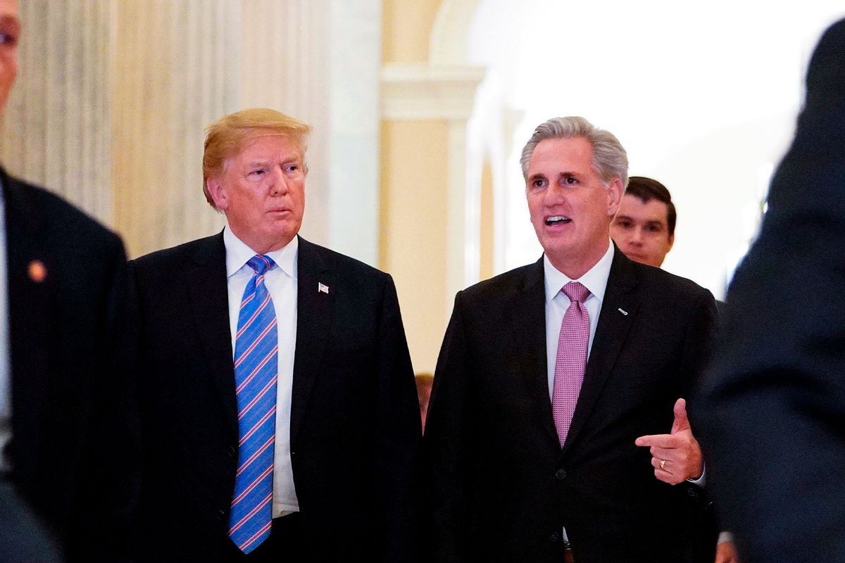 US President Donald Trump (2L) walks next to US House Majority Leader Kevin McCarthy (R-CA) after a meeting at the US Capitol with the House Republican Conference in Washington, DC on June 19, 2018. (MANDEL NGAN/AFP via Getty Images)