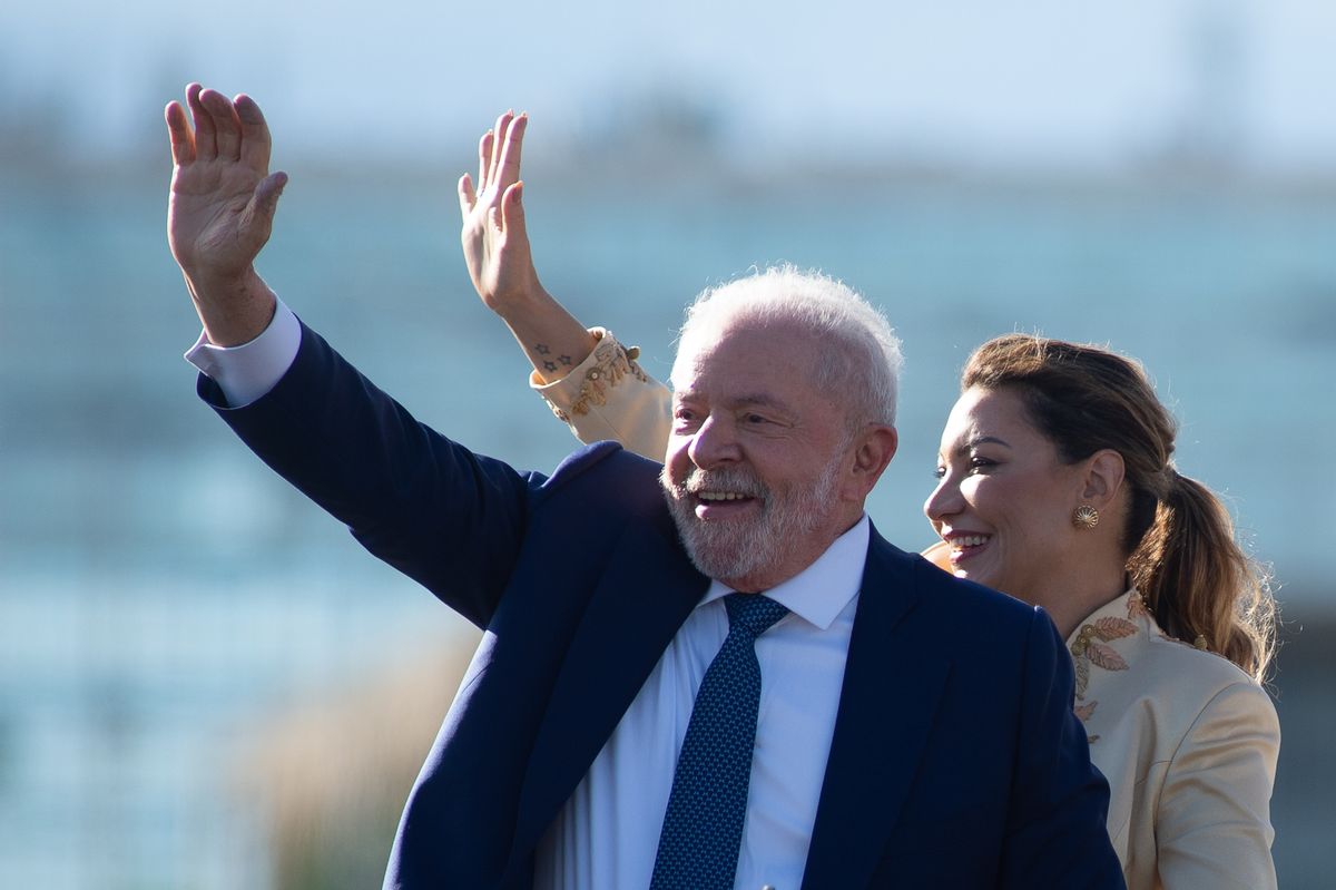 Luiz Inácio Lula da Silva waves to supporters along with his wife Rosangela da Silva as they head toward the National Congress in Brasília for his inauguration as Brazil's president on Jan. 1, 2023. ( Andressa Anholete/Getty Images)