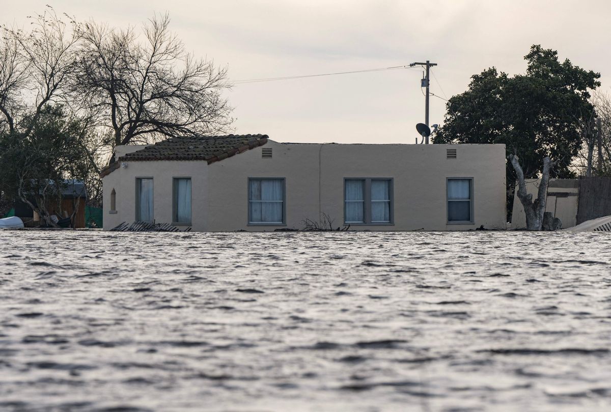  A house is submerged in floodwaters from the Salinas River near Chualar, California, on January 12, 2023. (NIC COURY/AFP via Getty Images)