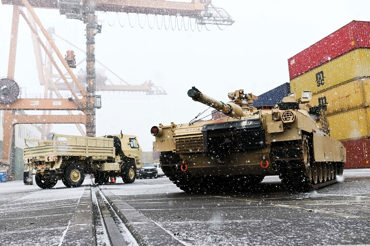 A M1A2 Abrams battle tank of the US army that will be used for military exercises by the 2nd Armored Brigade Combat Team, is unloaded at the Baltic Container Terminal in Gdynia on December 3, 2022. (MATEUSZ SLODKOWSKI/AFP via Getty Images)