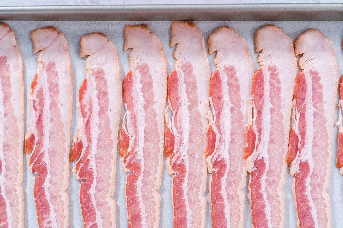 Raw bacon strips in tray ready to bake (Getty Images / Arina Habich / 500px)