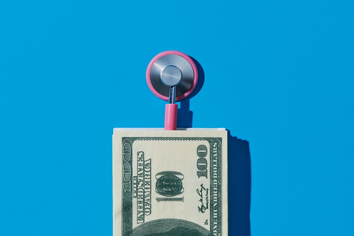 Stethoscope and US dollars (Getty Images/Juan Moyano)