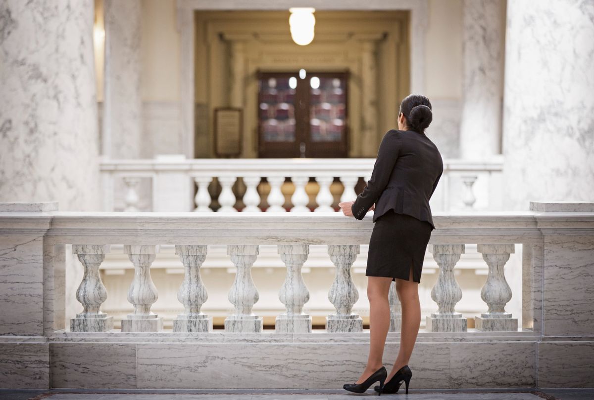 Politician standing in government building. (Hill Street Studios/Getty Images)