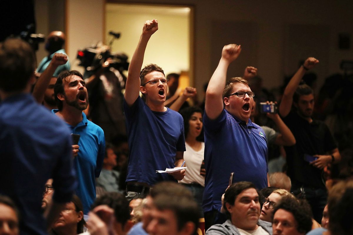 People react as white nationalist Richard Spencer, who popularized the term "alt-right" speaks at the Curtis M. Phillips Center for the Performing Arts on October 19, 2017 in Gainesville, Florida. (Joe Raedle/Getty Images)