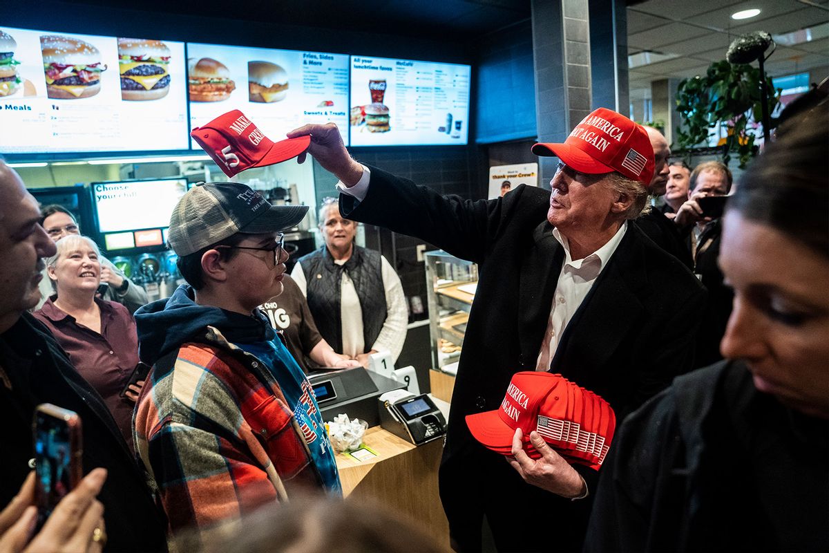 Former President Donald Trump, hands out MAGA hats and greets patrons during an off the record stop at a McDonald's restaurant during a visit to East Palestine, Ohio, following the Feb. 3 Norfolk Southern freight train derailment on Wednesday, Feb. 22, 2023, in East Palestine, Ohio. (Jabin Botsford/The Washington Post via Getty Images)