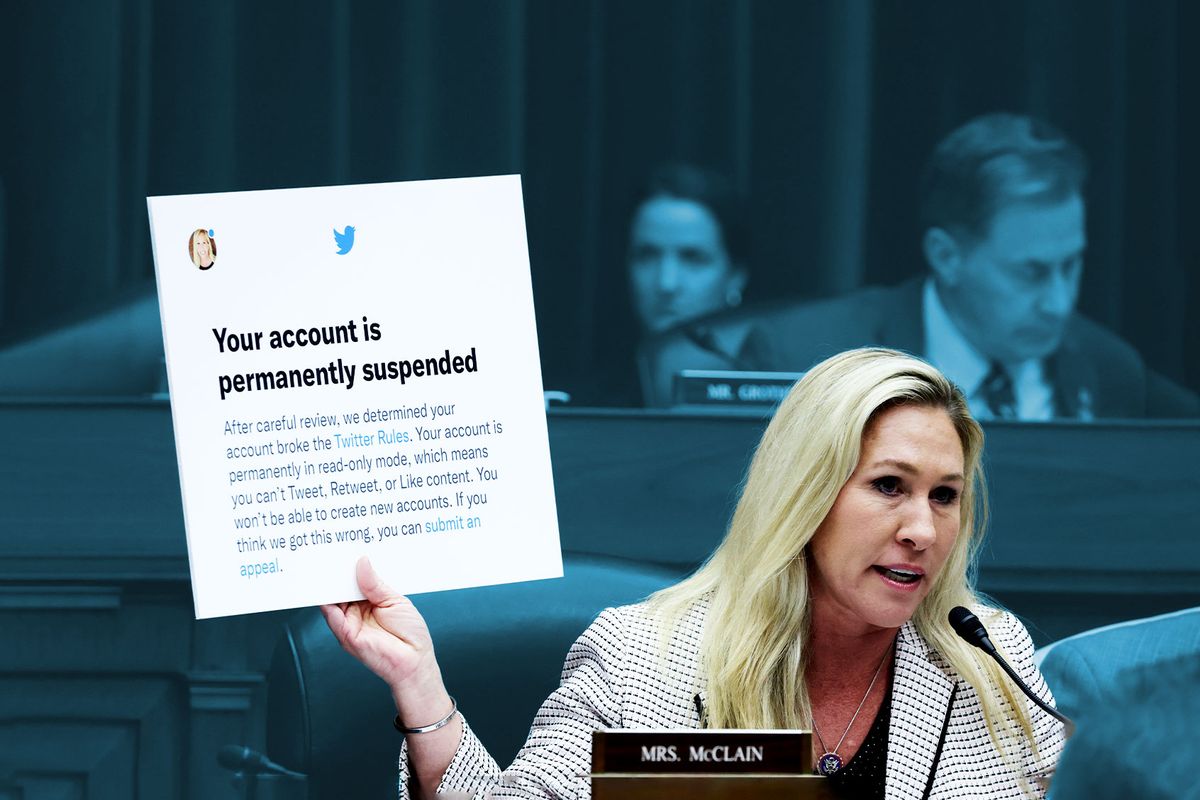 U.S. Rep. Marjorie Taylor-Greene (R-GA) holds up a poster of a Twitter announcement of suspending her account during a hearing before the House Oversight and Accountability Committee at Rayburn House Office Building on Capitol Hill on February 8, 2023 in Washington, DC. (Alex Wong/Getty Images)