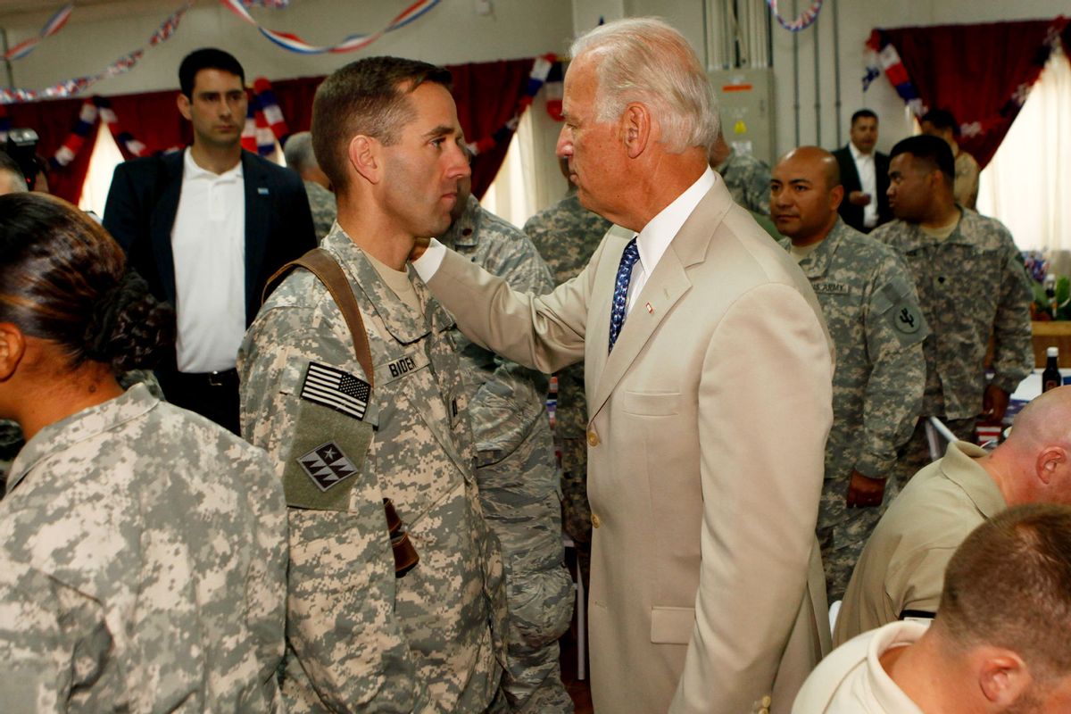 Joe Biden talks with his son U.S. Army Capt. Beau Biden (L) at Camp Victory on July 4, 2009 near Baghdad, Iraq. (Khalid Mohammed-Pool/Getty Images)