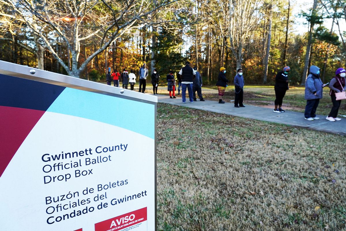 Voters stand in line to cast their ballots during the first day of early voting in the US Senate runoffs at Lenora Park, December 14, 2020, in Atlanta, Georgia. (TAMI CHAPPELL/AFP via Getty Images)