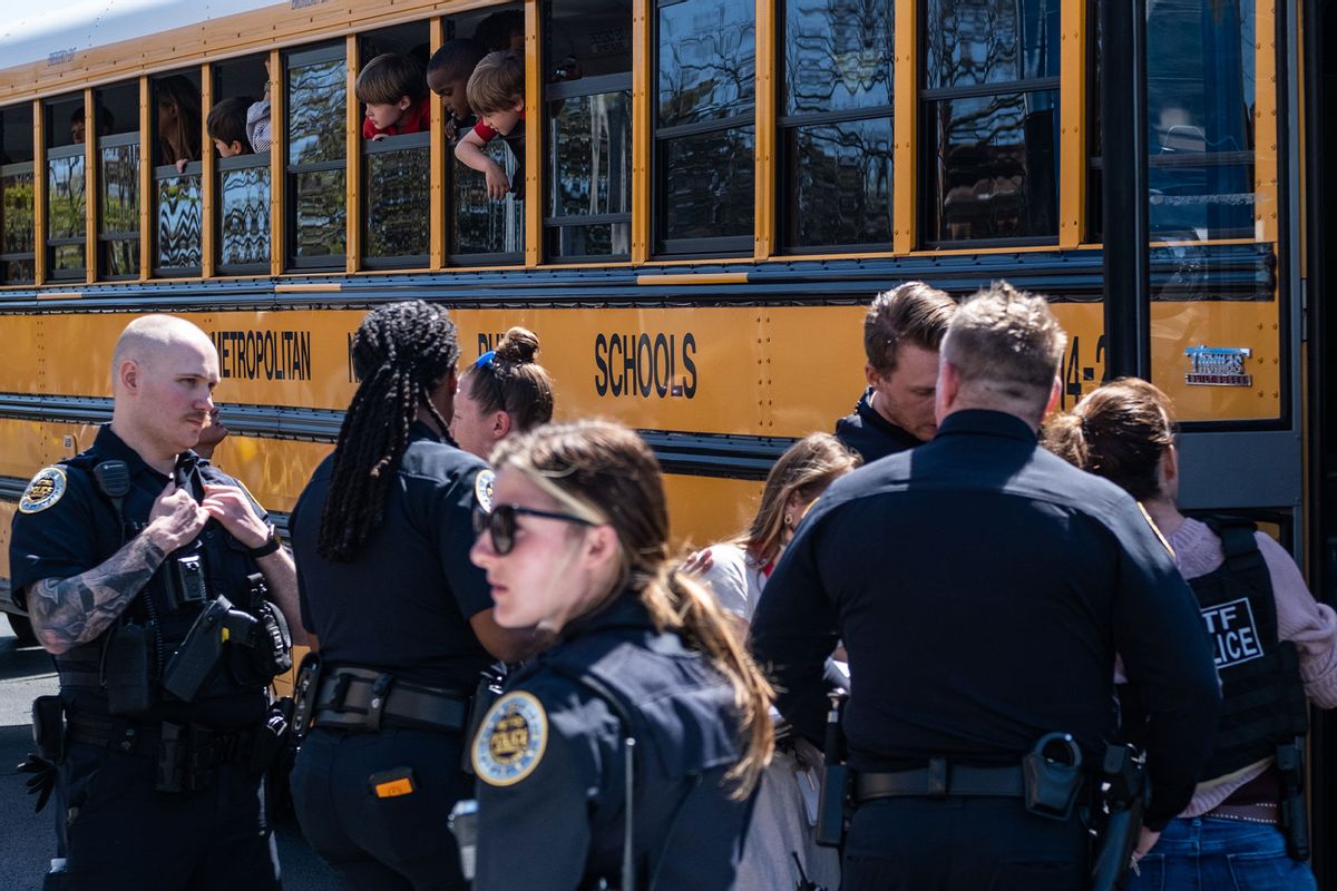 School buses with children arrive at Woodmont Baptist Church to be reunited with their families after a mass shooting at The Covenant School on March 27, 2023 in Nashville, Tennessee. (Seth Herald/Getty Images)