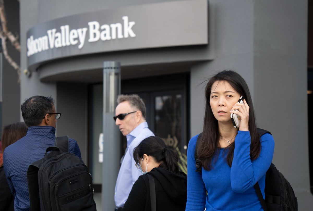 People queue up outside the headquarters of Silicon Valley Bank to withdraw their funds on March 13, 2023 in Santa Clara, California. (Liu Guanguan/China News Service/VCG via Getty Images)